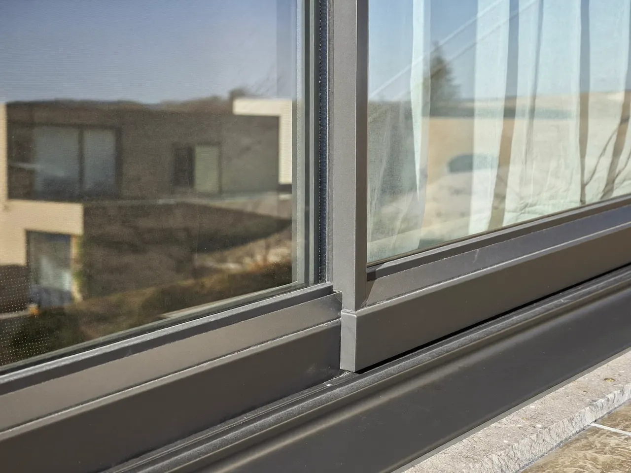 Slim aluminium window frame on a modern UK home extension