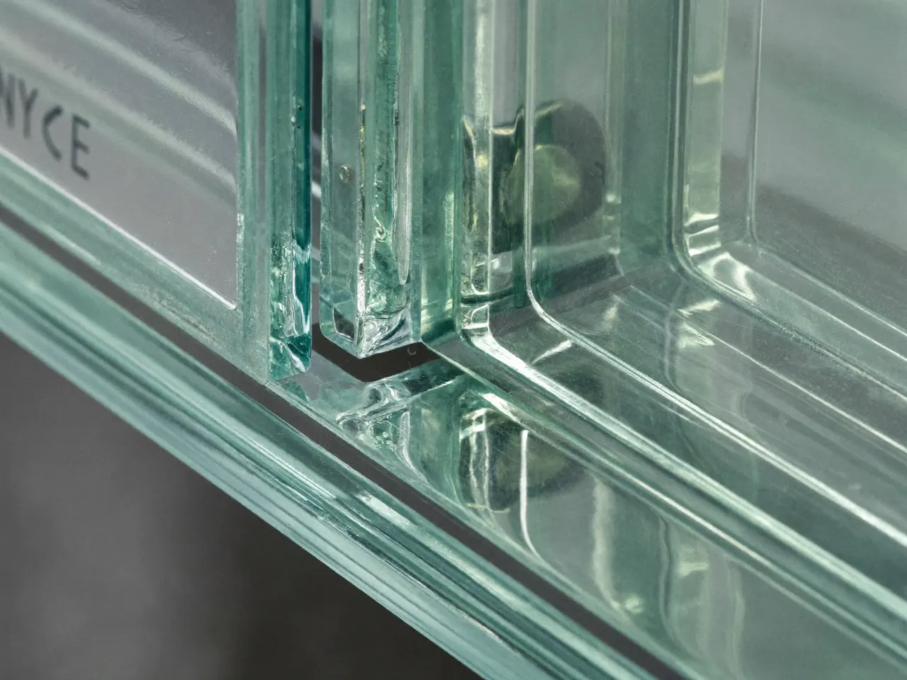 Close-up of a double-glazed sealed unit showing the spacer bar
