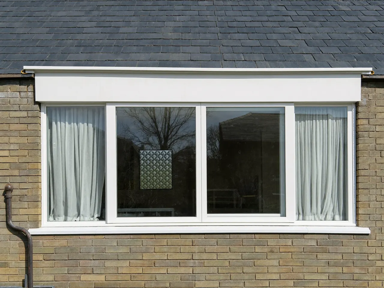Modern bay window fitted to a UK semi-detached home